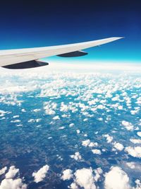 Aerial view of airplane flying in sky