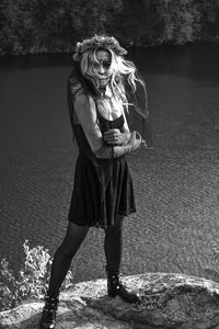 Full length of woman standing in water