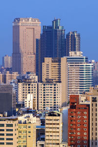 Modern buildings in city against sky