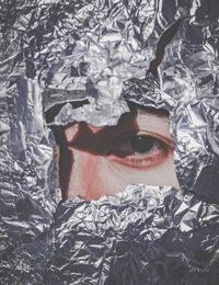 Close-up portrait of woman seen through foil paper