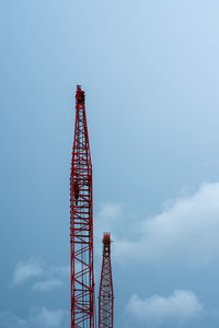 Low angle view of crane against sky