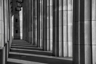 Shadow falling on colonnade of building