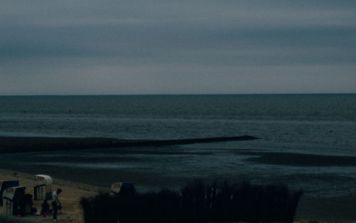 Scenic view of sea against sky at dusk