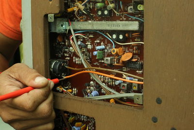 Close-up of man repairing computer chip