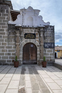 Entrance of historic building against sky