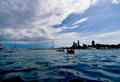 Scenic view of sea and buildings against sky