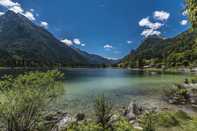 Scenic view of lake and mountains against sky