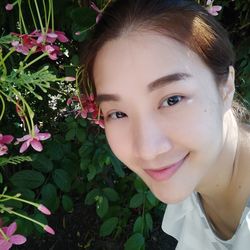 Portrait of smiling girl with flowers