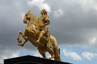 Low angle view of statue against sky