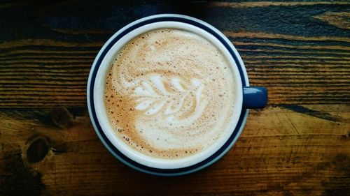 Close-up of cappuccino on table