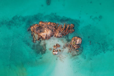 High angle view of rock formation in sea