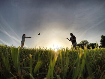 People on grassy field