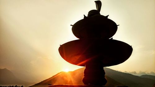 Low angle view of silhouette rock against sky during sunset