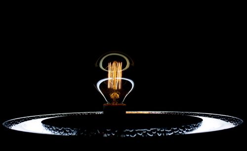 Close-up of water drop against black background