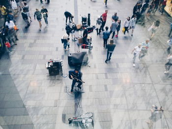 People walking on railroad station platform