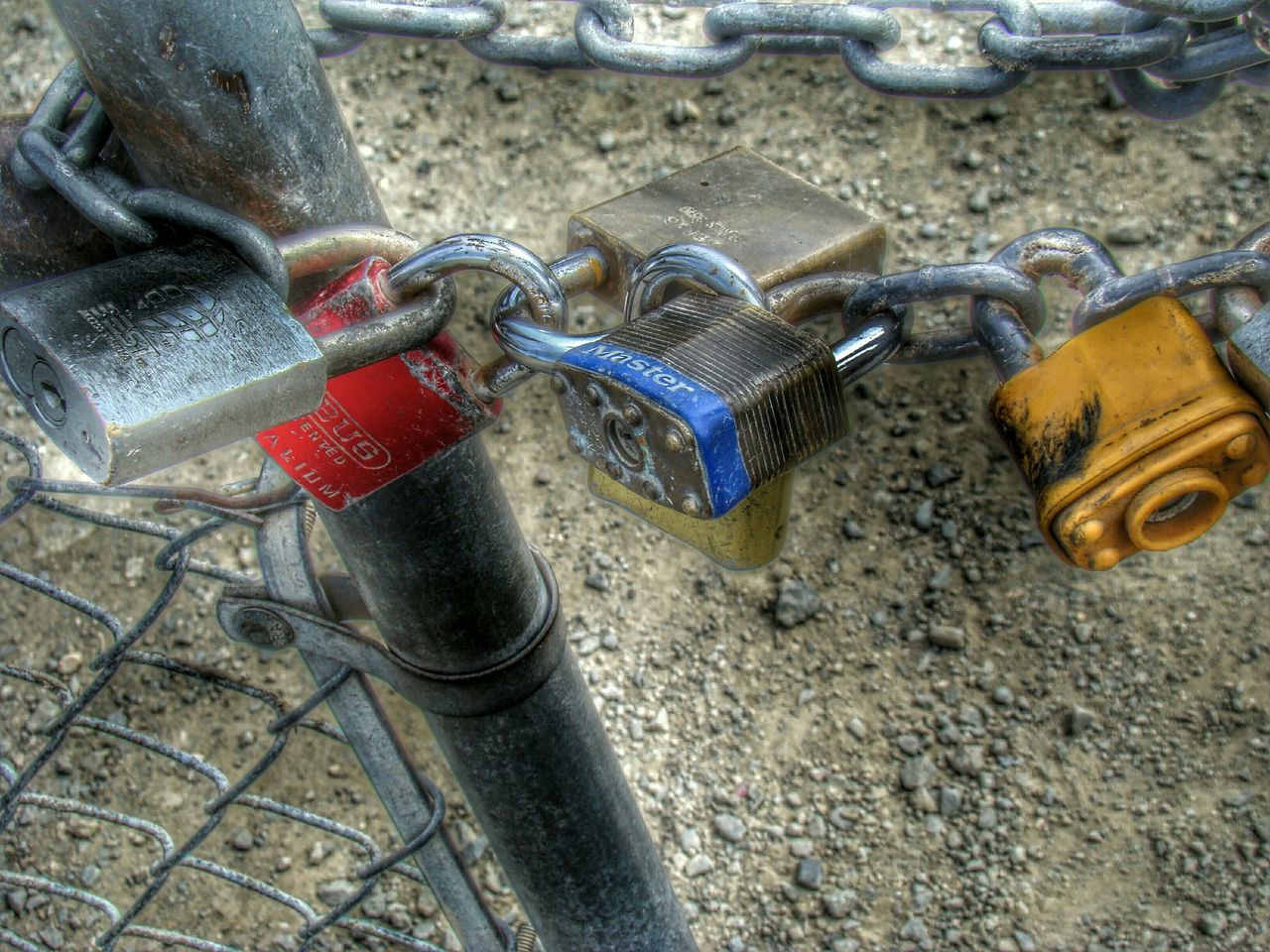 metal, high angle view, metallic, close-up, rusty, still life, day, outdoors, chain, equipment, abandoned, part of, protection, old, no people, padlock, safety, red, sunlight, obsolete