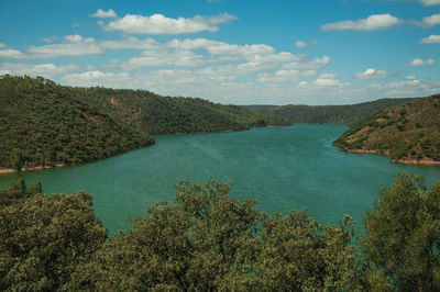 Scenic view of bay against sky