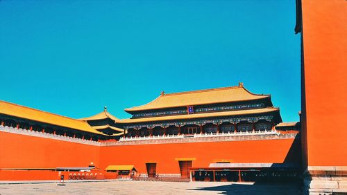 View of buildings against blue sky