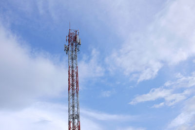 Low angle view of communications tower against sky