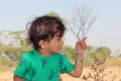 Boy wearing sunglasses against sky