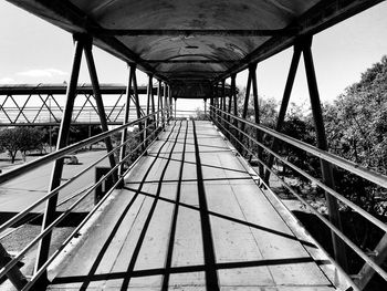 Footbridge against sky