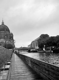 View of bridge over river in city