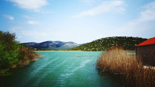 Scenic view of river against sky