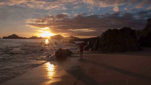 View of beach against sky during sunset