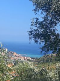 High angle view of sea against clear blue sky