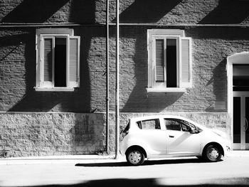 Car parked against building