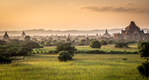 View of landscape against sunset sky