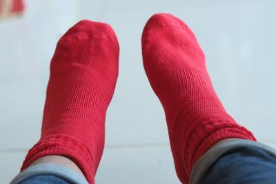 Low section of person wearing red socks