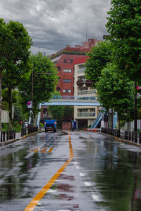 Wet street in city during rainy season