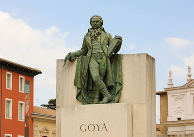 Low angle view of statue against building