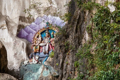 Group of people on rock against temple