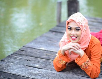 Portrait of a smiling young woman outdoors