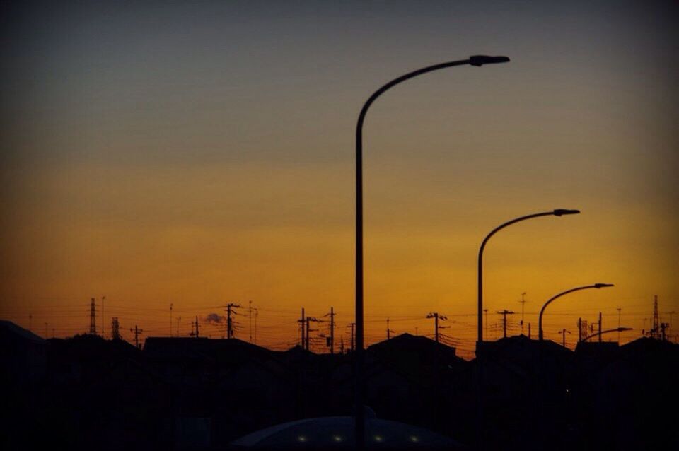 STREET LIGHT AGAINST SKY AT SUNSET