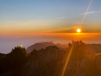 Scenic view of sunset over landscape