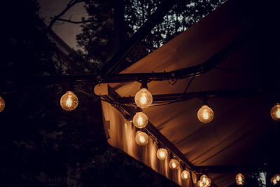 Low angle view of illuminated chandelier