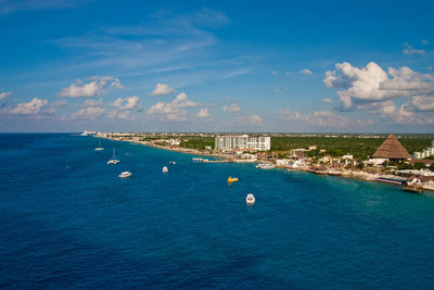 High angle view of bay in city against sky