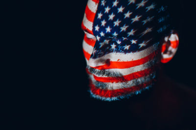 Close-up of flag against black background