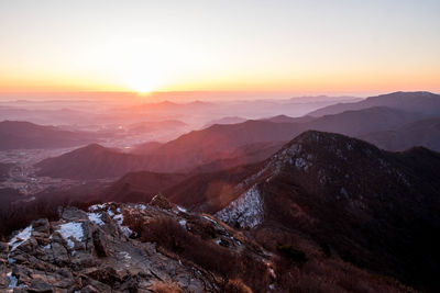 Scenic view of mountains against sky during sunset