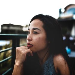 Portrait of young woman looking away