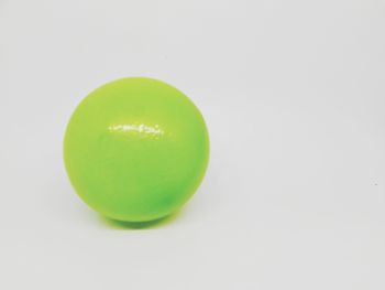High angle view of green apple against white background
