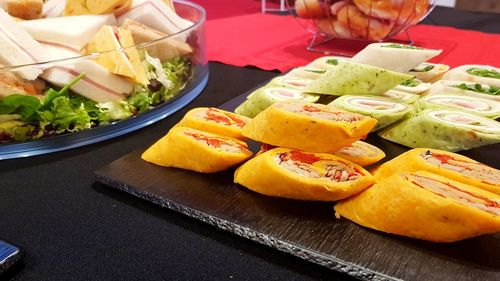 Close-up of hand holding food on table