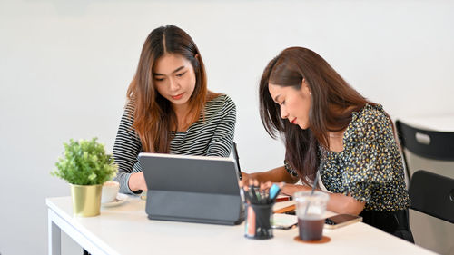 Business colleagues having discussion at office