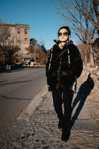 Young man standing on road