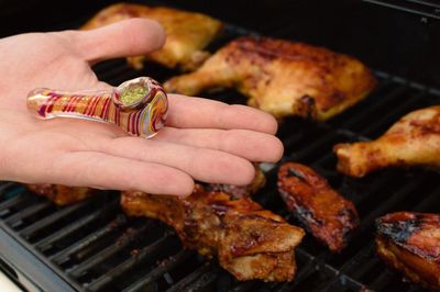 Cropped hand of person preparing food