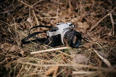 Close-up of vintage film photo camera on field