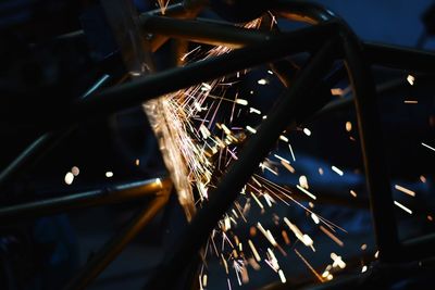 Sparks emitting from machinery at night